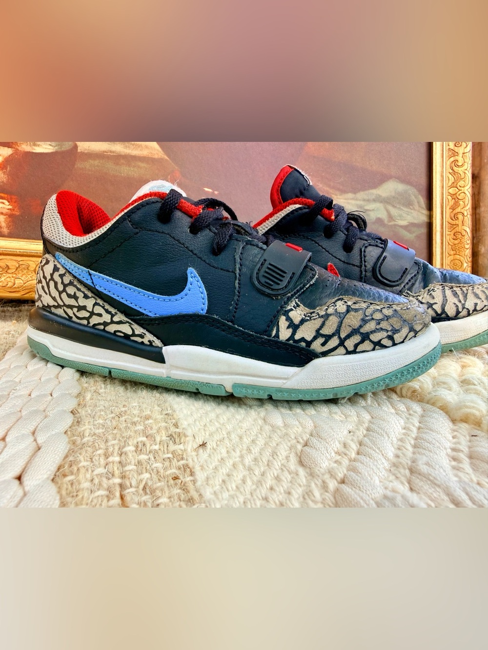 Nike Kids Black Sneakers with Blue Swoosh and Red Accents